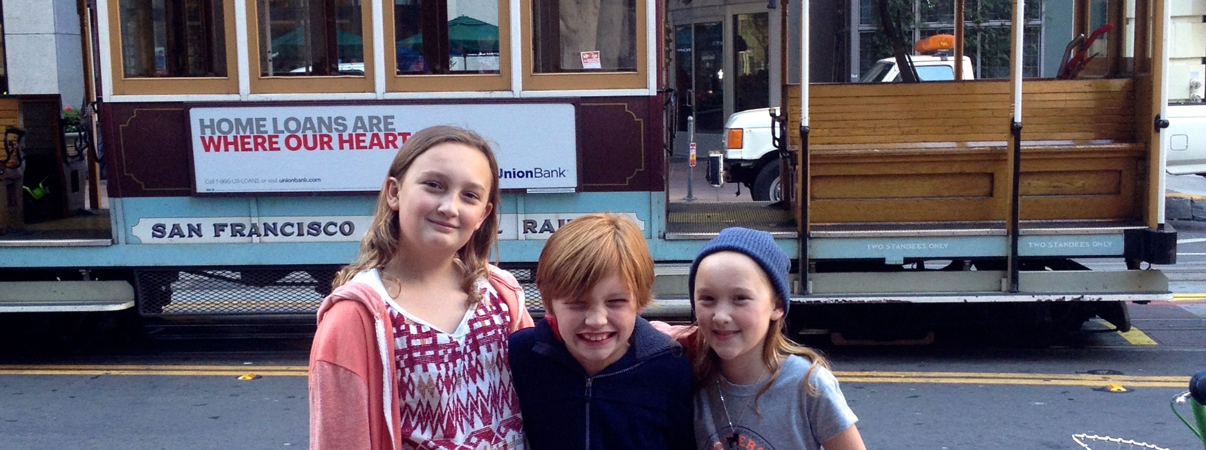 kids in front of trolley car